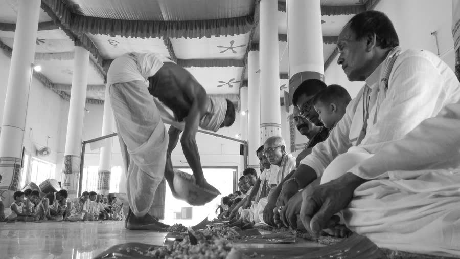 Community members seated together during the SRI SRI SANTA SAMAJ Annual Barsabah Namseva