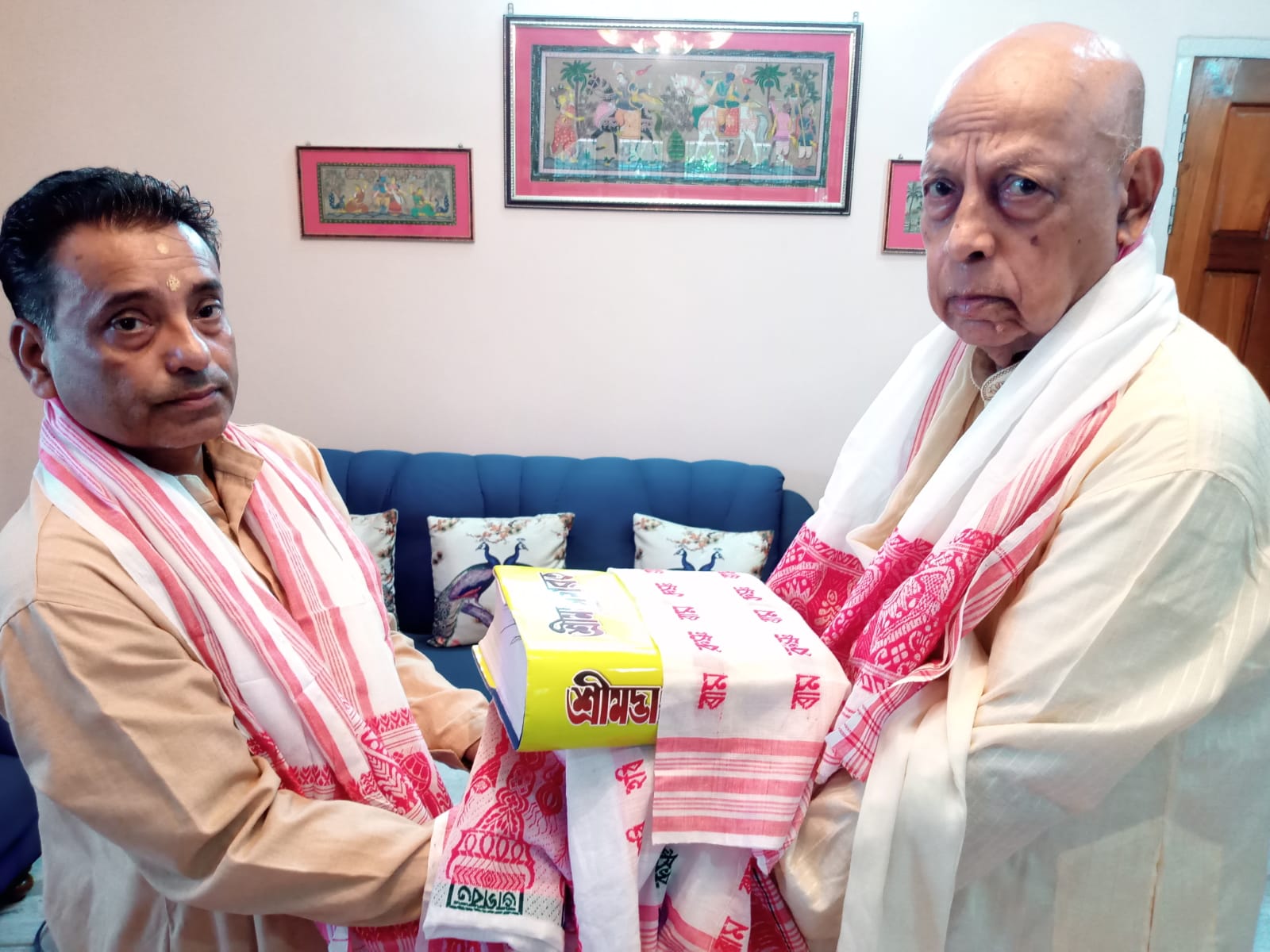 Presentation of religious literature and a gamosa during Sri Sri Santa Samaj's Nazira programme